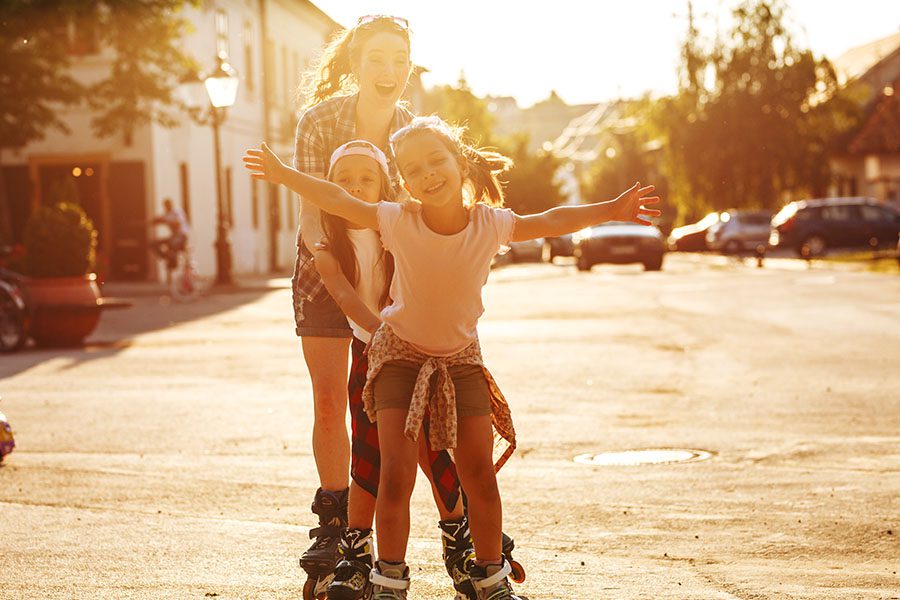 Contact - Excited Mom And Children Rollerblading On Empty Street