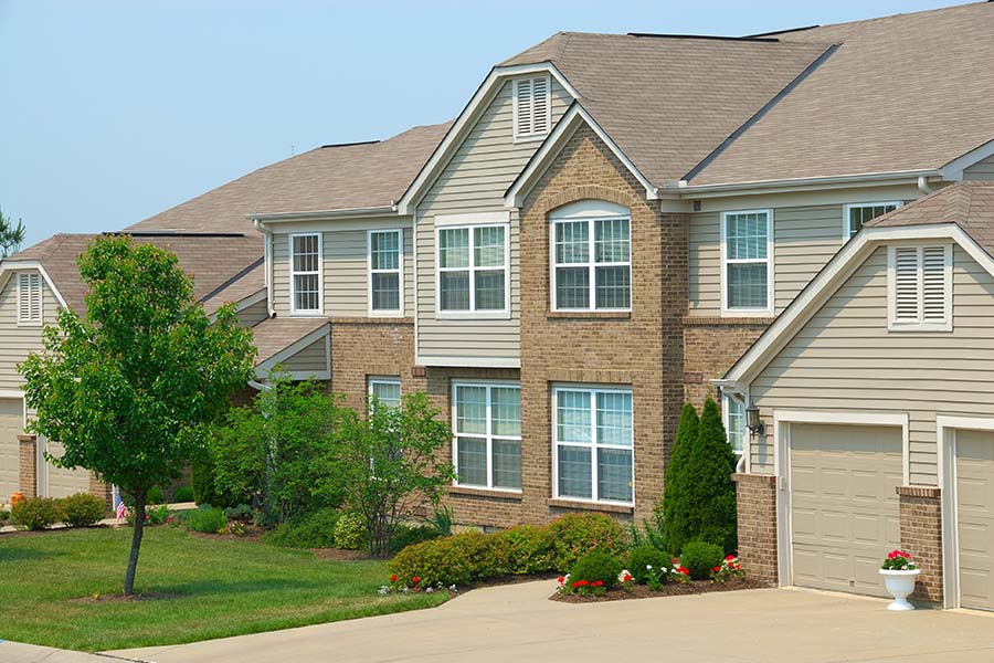 Condo Insurance - Row Of Two Story Condo Homes In The Suburbs